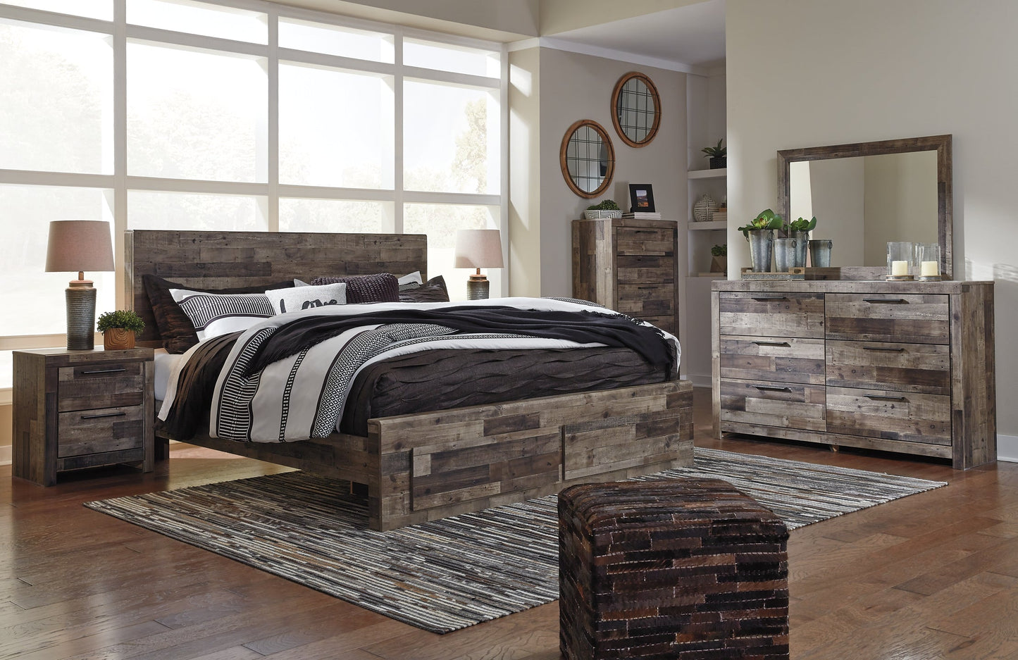 Derekson King Panel Bed with 2 Storage Drawers with Mirrored Dresser, Chest and 2 Nightstands Rent Wise Rent To Own Jacksonville, Florida