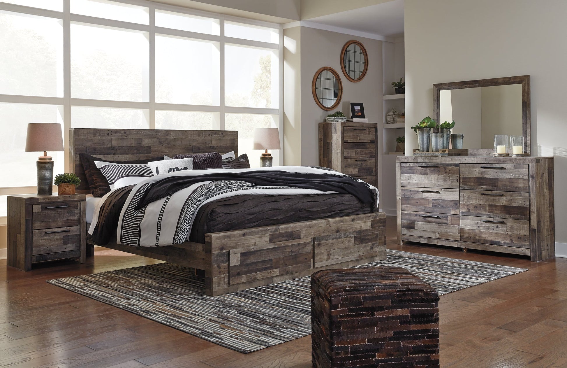 Derekson King Panel Bed with 2 Storage Drawers with Mirrored Dresser, Chest and 2 Nightstands Rent Wise Rent To Own Jacksonville, Florida