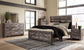 Wynnlow King Crossbuck Panel Bed with Mirrored Dresser, Chest and 2 Nightstands Rent Wise Rent To Own Jacksonville, Florida