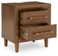 Lyncott  Upholstered Bed, Dresser, Mirror, Chest And Nightstand