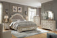 Realyn  Upholstered Bed With Mirrored Dresser